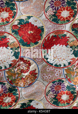 Tokyo, Japan - May 14, 2017: Japanese silk embroidery with flower design close up full frame for kimono Stock Photo