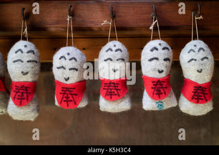 Kyoto - Japan, May 22, 2017:   Protection dolls hanging at a Japanese temple Stock Photo