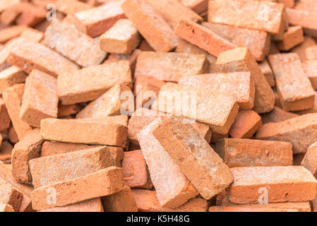 Red brown brickbats lying on ground Stock Photo