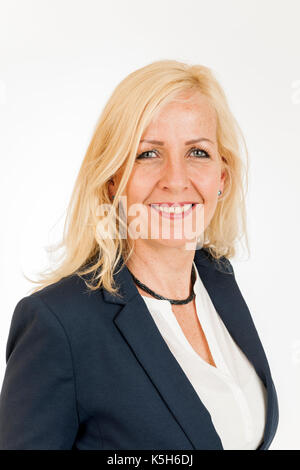 Head-and-shoulders portrait of a blonde middle-aged woman isolated on white. Stock Photo
