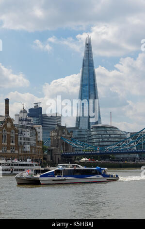 Thames clipper on the River Thames with Shard skyscraper in the background, London England United Kingdom UK Stock Photo