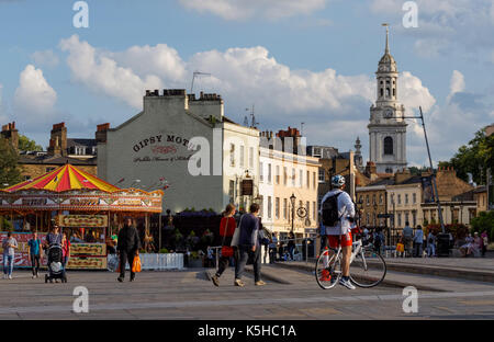 People on Greenwich Church Street with St Alfege church in the background, London, England, United Kingdom, UK Stock Photo