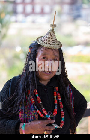 Nomad from Laya in traditional dress at Punakha Dzong during the annual Tsechu (religious festival), Western Bhutan. Stock Photo