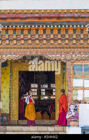 Nuns at the Sangchen Dorji Lhuendup nunnery above Punakha, Western Bhutan. Stock Photo