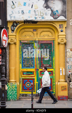 Multicolored door to building with artist studios at 59 rue de Rivoli, Paris, France Stock Photo