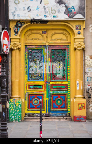 Multicolored door to building with artist studios at 59 rue de Rivoli, Paris, France Stock Photo