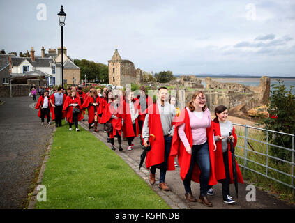 New students at the University of St Andrews take part in the traditional Pier Walk along the harbour walls of St Andrews before the start of the new academic year. The Martinmas Semester starts on Monday September 11, 2017, for all students. Stock Photo