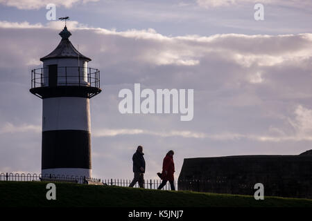 People taking a morning walk next to Southsea Castle Stock Photo