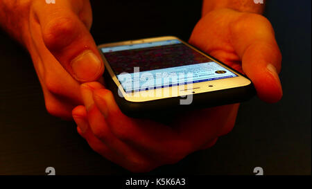 writing on the keyboard and mobile phone Stock Photo