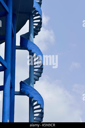 Close up of Blue Spiral Staircase on Elevated Water Tank Stock Photo