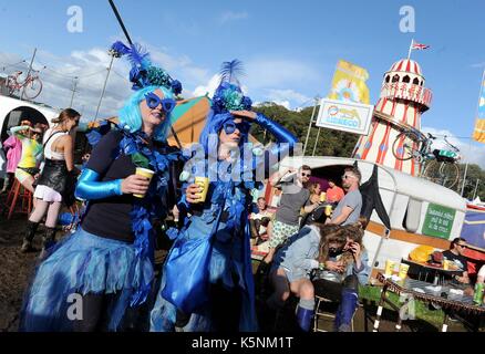 Festival goers enjoy the atmosphere at Bestival music festival at Lulworth Estate, Dorset, UK Stock Photo