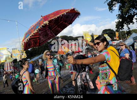 Festival goers enjoy the atmosphere at Bestival music festival at Lulworth Estate, Dorset, UK Stock Photo