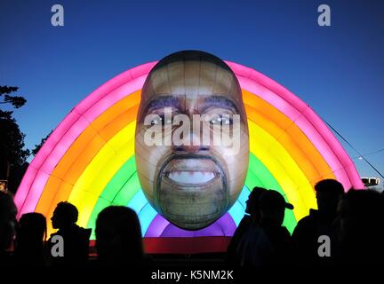 Inflatable Kanye West at Bestival Music Festival. Inflatable Kanye West Credit: Finnbarr Webster/Alamy Live News Stock Photo