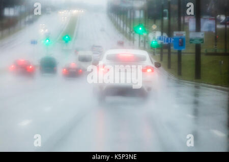 road blurred view through car windshield during heavy rain Stock Photo