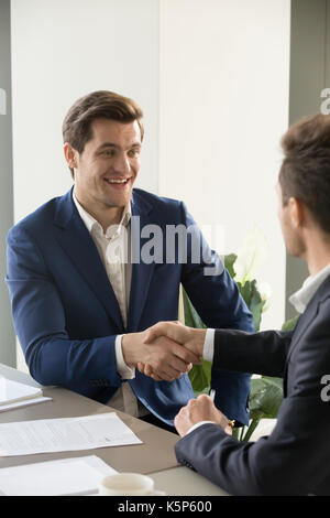 CEO congratulating new member of business team Stock Photo