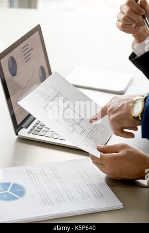 Architects planning construction budget in office Stock Photo