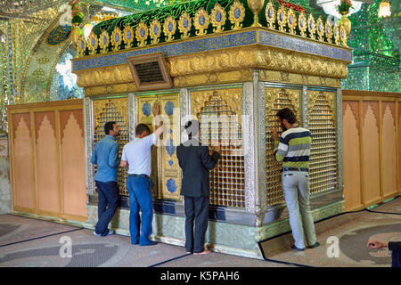 Fars Province, Shiraz, Iran - 18 april, 2017:  Muslims pray in Mosque, Mirrored mausoleum of Sayyed Alaeddin Hossein. Stock Photo