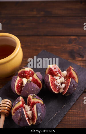 Delicious dessert made with figs fruit, cheese and honey Stock Photo