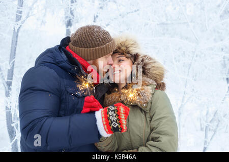 Couple with sparklers outdoors Stock Photo