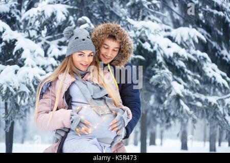 pregnant couple in winter Stock Photo