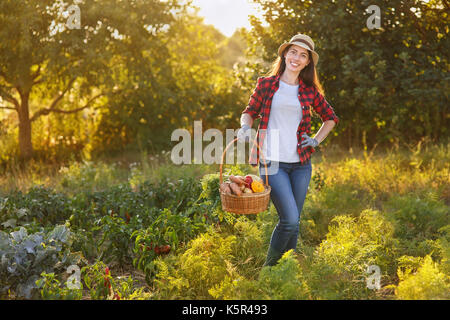 woman with basket of vegetables Stock Photo