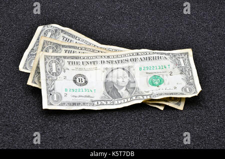 dollar bill on black sand close up photo Stock Photo