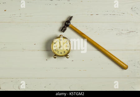 Hammer Pounding Alarm Clock Stock Photo