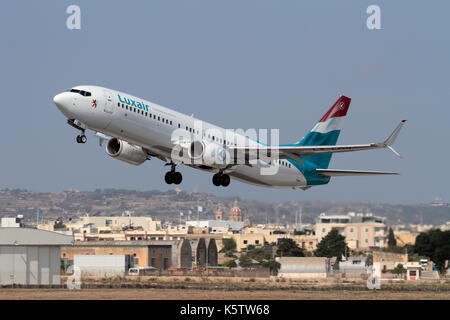 Civil aviation in the EU. Luxair Luxembourg Airlines Boeing 737-800 jet plane taking off from Malta Stock Photo