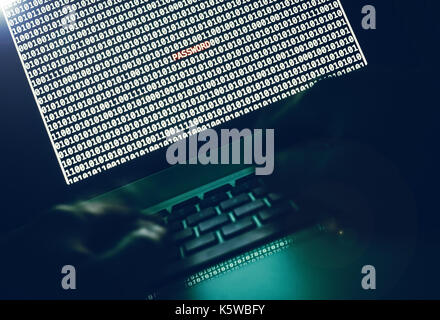 Computer internet hacker, binary code on laptop screen Stock Photo