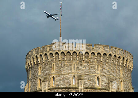 British Airways Airbus A380 aircraft / aeroplane / air plane / flight from Heathrow airport passing over the round tower of Windsor Castle Stock Photo