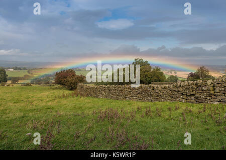 Teesdale landscape, vivid rainbow over Lower Teesdale on a blustery autumn day from Barningham, County Durham, UK September 2017 Stock Photo