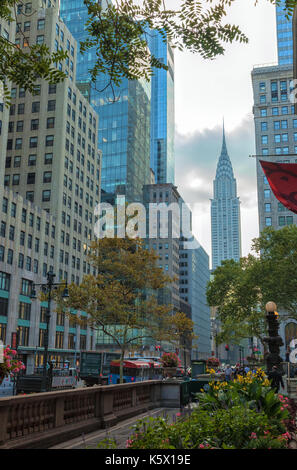 The street of New York City with the high rises and the Chrysler Building in the background Stock Photo