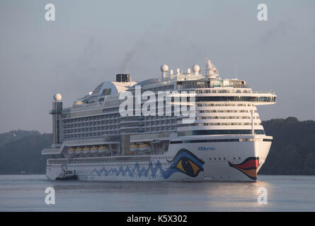 Hamburg, Germany, June 10, 2017 - Crusising Ship Aida Prima is entering the Port of Hamburg in the early daylight Stock Photo