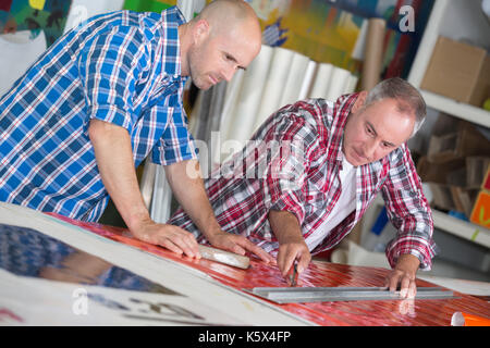 two architects working on a project at home office Stock Photo
