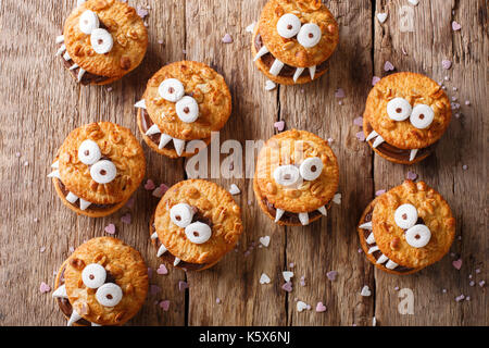 Peanut cookie monsters for helouinna close-up on the table. top view from above horizontal Stock Photo