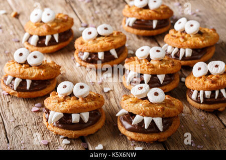Toothed monsters of cookies close-up on a table for Halloween. horizontal Stock Photo