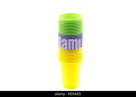 Coloured plastic cups stacked, yellow, green, purple Stock Photo