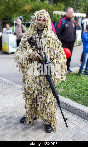 Samara, Russia - September 10, 2017: Unidentified Russian soldier with sniper rifle in hand at the  street during the city festival Stock Photo