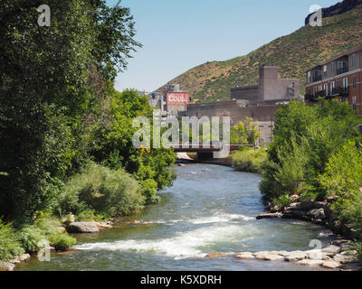 Golden, CO - August 12:  The Coors brewery in Golden, Colorado, that is the largest single brewery facility in the world.   The Clear Creek runs throu Stock Photo