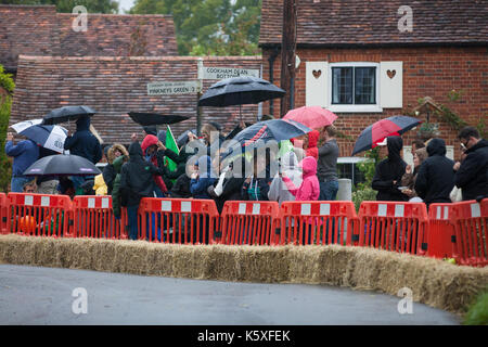 Cookham Dean, UK. 10th Sep, 2017. Racegoers with umbrellas at the Cookham Dean Gravity Grand Prix in aid of the Thames Valley and Chiltern Air Ambulance. Credit: Mark Kerrison/Alamy Live News Stock Photo