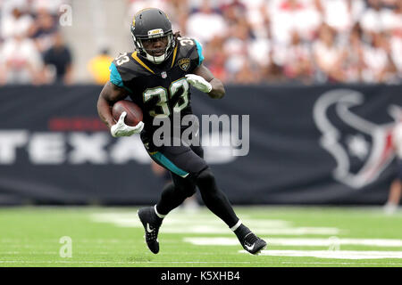 Jacksonville Jaguars running back Chris Rodriguez Jr. (24) is tackled ...