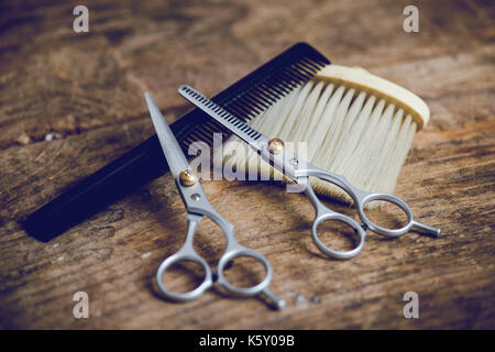 hairdresser tools on wooden table Stock Photo