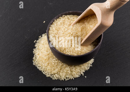 Scoop of rice on puffed rice cereal background close up Stock Photo