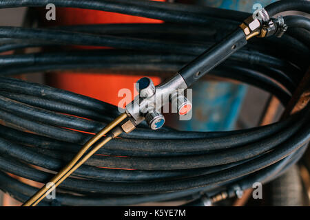Working hoses in a garage. Stock Photo