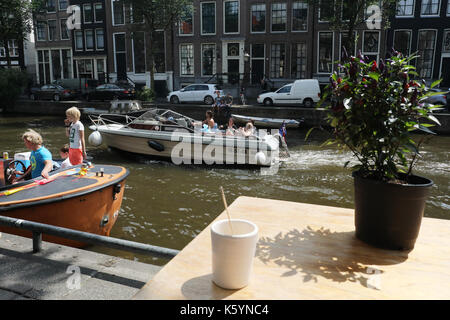 canal life on the boat in Amsterdam , holland Stock Photo