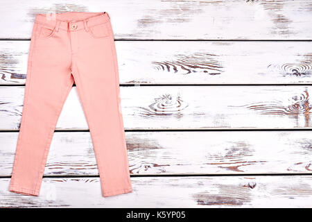 Teen girls modern summer trousers. Female slim peach color pants