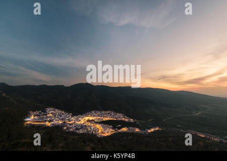 Long exposure of the religious town Moulay Idris in Morocco at sunset with a beautiful sky and some lightning in the streets. Stock Photo