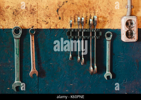 Working keys of repair personnel weigh on the wall. Stock Photo