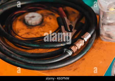 Working hoses in a garage. Stock Photo