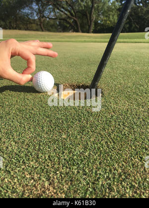 Giving the Golf Ball a Gentle Persuasion Stock Photo